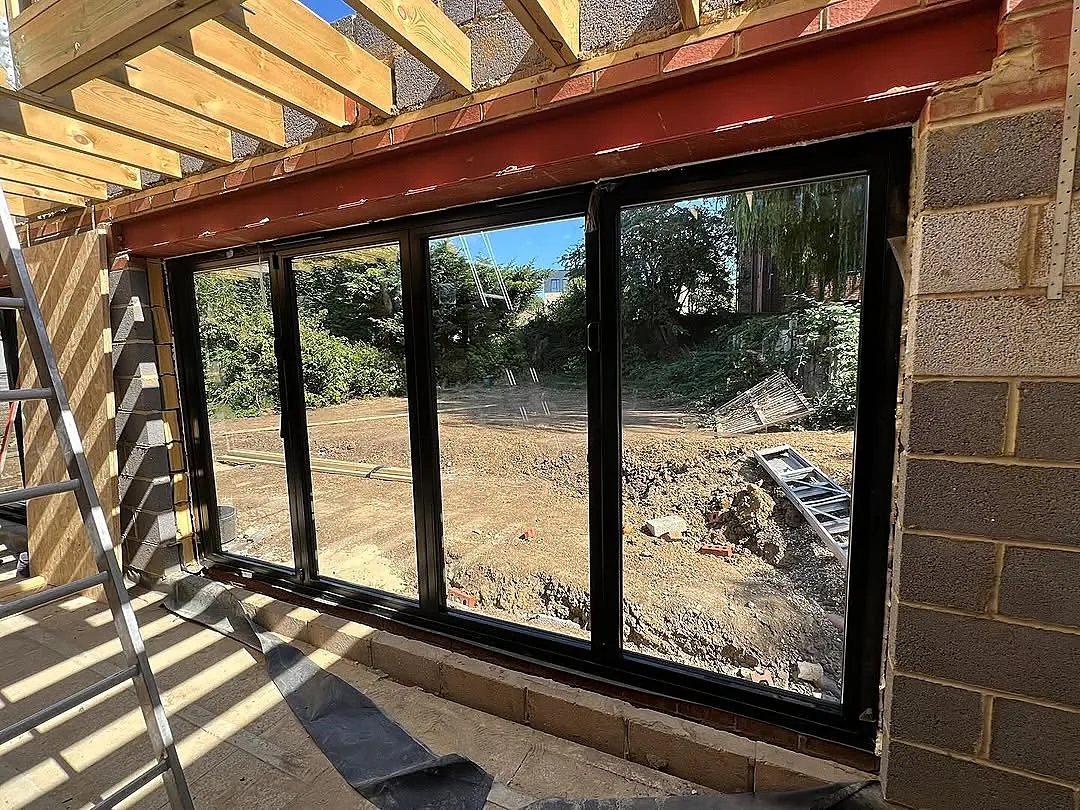 Black sliding doors going into the new rear extension
